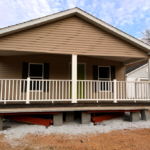 Manufactured Home with balcony recently set on Blocks